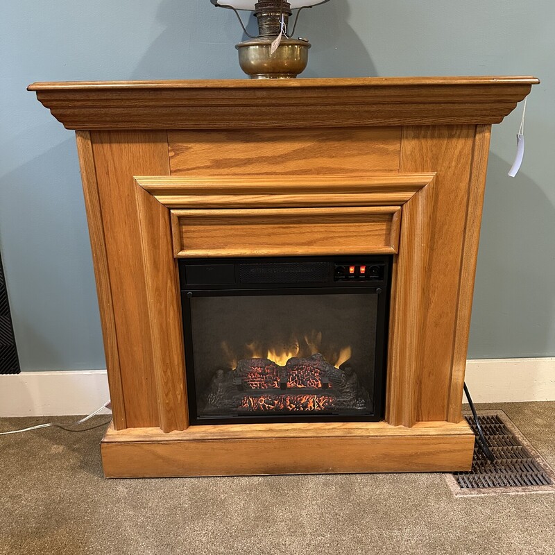 Elec. Fireplace W/Mantel,<br />
Size: 37 X 12 X35<br />
Would you like a fireplace but just cannot have one ? Now you can.  Wood oak free standing mantel surrounds this working electric fireplace.  This works perfectly with an on/off switch located in the front.