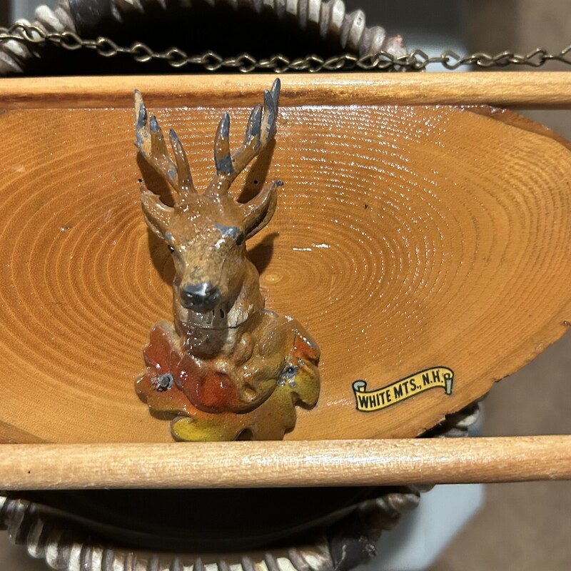 White Mtns. Souv. Towel Rack<br />
Size: 17 X 5<br />
Live edge wood with metal stag in center.  The vintage White MT NH label is prominent. Is hung by an attached chain with towel bar in front.<br />
Beautiful condition - one of a kind!