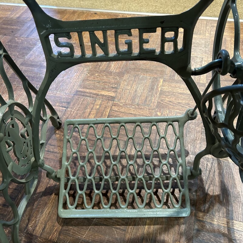 Singer Sewing Base Table,<br />
Size: 42x18x29<br />
Original Singer Sewing machine base with working tredle, that is painted a soft vintage green.  Finished oak top with beveled edges.