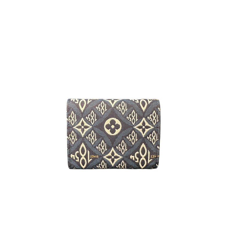 LOUIS VUITTON Jacquard Since 1854 Victorine Wallet in Blue. This chic coin purse is crafted of blue and white Jacquard Since 1854 textile. The zipper opens to a partitioned beige leather interior with card slots and pockets.<br />
<br />
Date Code:SP4250<br />
<br />
Condition: Excellent<br />
<br />
Does not include original dust bag or box.