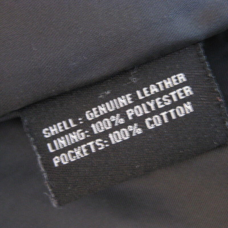 Guess Leather Moto, Gray, Size: Medium<br />
This simple hip length double breasted gray leather jacket has a bit of an edge but wearable to work and any other occasion.  Trench details, peacoat adjacet it's fully line with side pockets and straps at the end of the cuffs.<br />
Button closures<br />
It has pockets and a high and wide notched lapel<br />
<br />
Excellent pre-owned condition!<br />
It's marked size M, but I am calling it a small.  The measurements, as you will see are too small for a modern size M, I am a size medium and I tried it on and it was too snug for me all over.<br />
<br />
Here are the flat measurements:<br />
Shoulder to shoulder: 15.75<br />
Armpit to armpit: 19.5<br />
Width at hem: 18<br />
Length: 25<br />
underarm sleeve seam: 17<br />
<br />
Thanks for looking!<br />
#80698