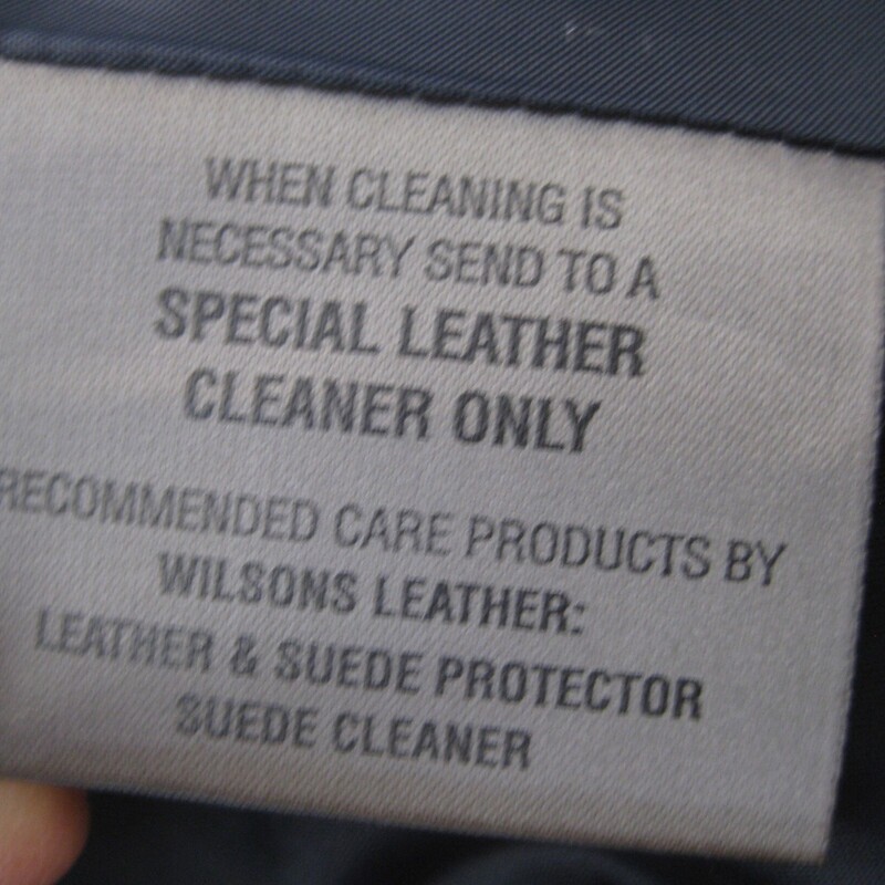 Wilsons Suede Coat, Blue, Size: M<br />
smart blue suede coat by Wilson.<br />
marked size M<br />
it features white top stitching, pockets and is fully lined.<br />
fitted at the waist with a little flare to the 'skirt'<br />
It's used, but in great shape.<br />
flat measurements taken on the outside of the coat while lying flat:<br />
shoulder to shoulder: 16.5<br />
armpit to armpit: 20<br />
waist area: 18<br />
hip area: 21.25<br />
length: 37.5<br />
underarm sleeve seam: 18<br />
In my opinion, as a size medium person, I feel this coat is a little too fitted for me on the top.<br />
If you are a slim size medium or a junior sized gal, it should fit fine.<br />
<br />
thanks for looking!<br />
#73106