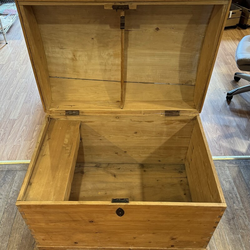 Large German Wood Trunk<br />
<br />
Very large wooden trunk from Germany.  Inside has a side tray which is removable. Top of trunk has a crack.<br />
<br />
Size: 37 in wide X 26 in deep X 29 in high