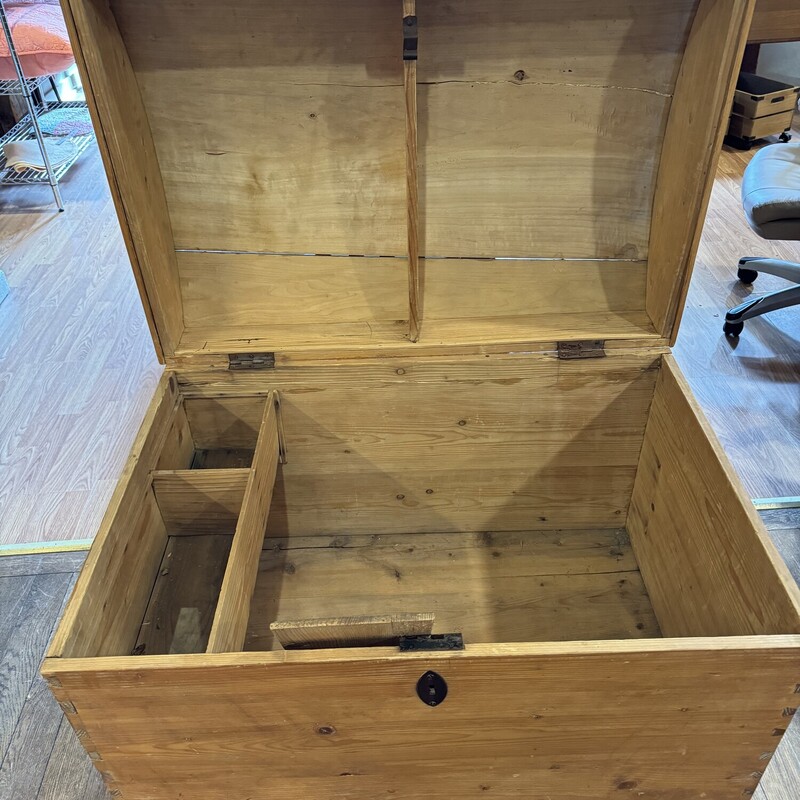 Large German Wood Trunk<br />
<br />
Very large wooden trunk from Germany.  Inside has a side tray which is removable. Top of trunk has a crack.<br />
<br />
Size: 37 in wide X 26 in deep X 29 in high