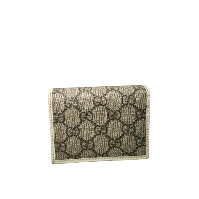 Gucci Horsebit 1955 Wallet
Beige/ebony GG Supreme canvas
White leather details
Gold-toned hardware
Viscose lining
Horsebit detail
Inside: 5 card slots, open pocket, 1 zipper pocket, 1 bill compartment
Snap button closure
Open: 4.3W x 6.9H
Closed: 4.3W x 3.3H x 1.2D
Made in Italy

Condition: Like New
Style code:621887.0416

Comes with original box and dust bag.