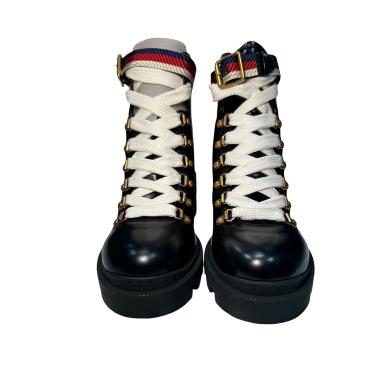 Gucci Magnum Combat Boots<br />
Size: 36.5<br />
 Leather Ankle Combat Boots<br />
Sylvie Web Accent<br />
Rubber Trim<br />
Round-Toes<br />
Platform<br />
Wrap-Around Straps & Lace-Up Closure at Uppers<br />
<br />
Code:481156-0411<br />
<br />
Comes with original box and dust bags.