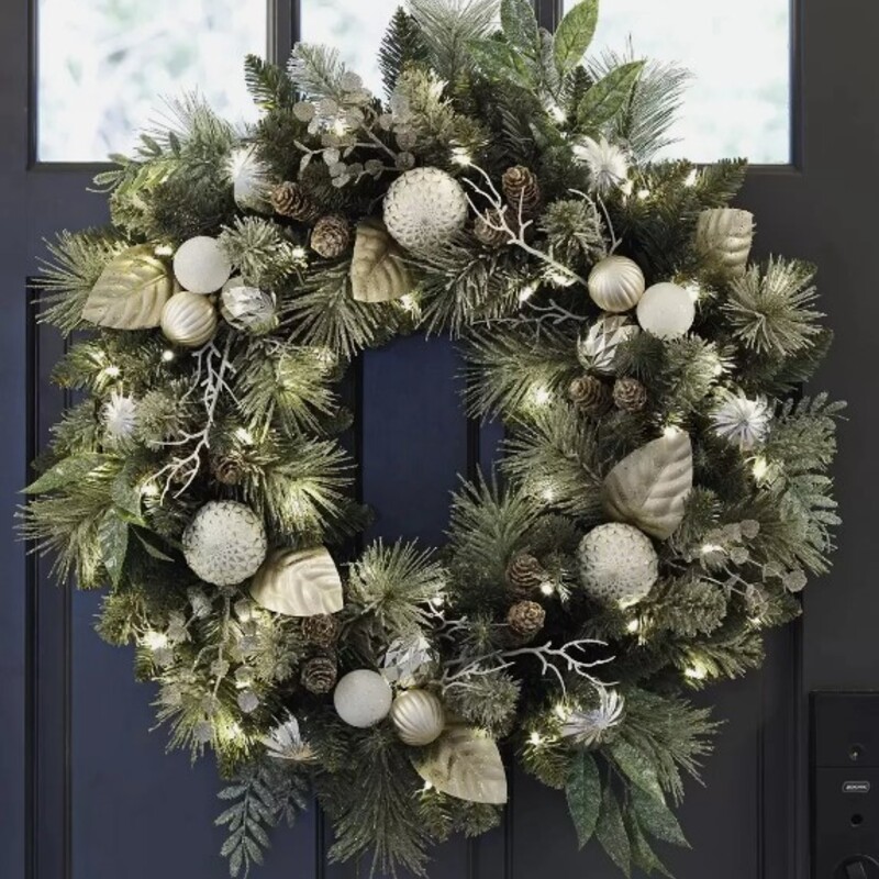 CG Hunter LED Wreath
Green Silver White Green
Size: 24x24
Make your guests feel welcome with this radiant pre-lit holiday wreath. It’s a mix of natural looking greenery and shimmering bulbs, all carefully hand crafted and accentuated by dozens of miniature warm white lights. Simply place it on your front door and let the celebrations begin. A fuller look can be easily achieved by gently moving and arranging the branches and decorations.Pre-Lit with 50 warm white led lights
Timer function 6 hours on / 18 hours off
For indoor and sheltered outdoor use
Fully decorated
Requires 3 D batteries