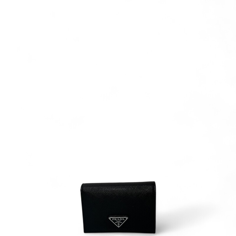 Prada Saffiano Black Compact Wallet
Saffiano leather wallet with enameled metal triangle logo expresses sleek elegance. The accessory with clean lines has a zipper coin compartment, bill compartment, and five card slots.
Snap fastener
Enameled metal triangle logo
One bill compartment
Four card slots
Two internal pockets
Internal coin pocket with zipper
Dimension: 8.5'' W x 11.2'' H