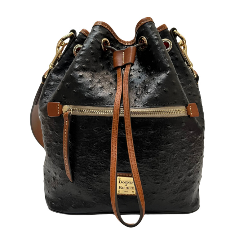 Dooney&Bourke  Ostrich Drawstring Handbag<br />
Embossed calfskin leather<br />
Drawstring closure.<br />
Detachable Shoulder strap. Strap drop length: 13.<br />
H 10.5 x W 5.25 x L 8.75<br />
1 lb 9 oz<br />
Designed in Norwalk, CT by Peter Dooney.<br />
One outside zip pocket. One inside zip pocket. Two inside pockets.<br />
Cell phone pocket.<br />
Inside key hook.<br />
Lined.<br />
Feet.<br />
Color: Black, and Tan