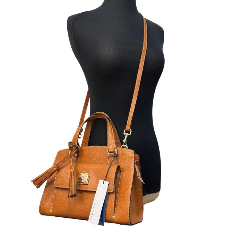 Dooney&Bourke Nana Satchel<br />
Italian Saffiano leather.<br />
Zipper closure.<br />
Detachable strap. Strap drop length: 23.25.<br />
H 7.75 x W 5 x L 10.5<br />
1 lb 10 oz<br />
Color: Natural<br />
Designed in Norwalk, CT by Peter Dooney.<br />
One outside pocket. Two inside slip pockets.<br />
One inside zip pocket.<br />
Inside key hook.<br />
Lined.<br />
Feet.