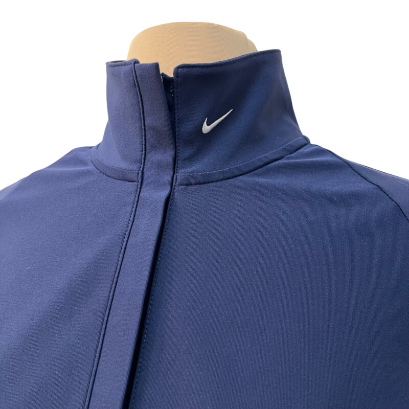 Nike Zip Pullover<br />
NIke Golf<br />
Dry Fit<br />
Ribbon detail on sleeve<br />
Cinched<br />
Color: Navy, and White<br />
Size: Medium