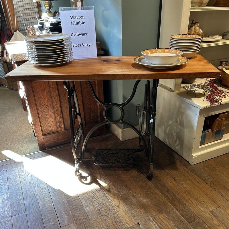 Sew Machine Base Table,
Size: 46x18x30
This table is on a sewing machine base from the Household Sewing Machine Company based in Dayton, Ohio in 1895. The board on top is finished with lemon oil and beeswax which brings out the natural beauty of the board.