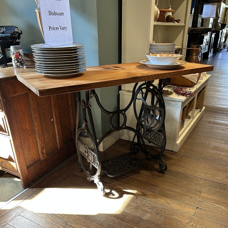 Sew Machine Base Table,
Size: 46x18x30
This table is on a sewing machine base from the Household Sewing Machine Company based in Dayton, Ohio in 1895. The board on top is finished with lemon oil and beeswax which brings out the natural beauty of the board.