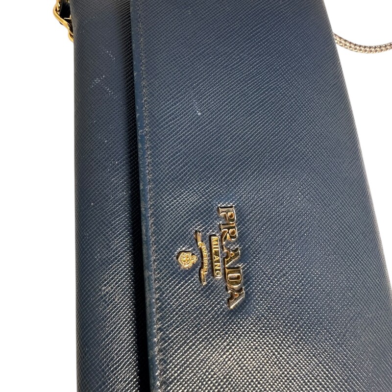 Prada Wallet On Chain Crossbody  Blue<br />
 Size: OS<br />
<br />
Factory code: 198<br />
<br />
Dimensions:<br />
Length: 8.25 in<br />
Height: 4.25 in<br />
Width: 1 in<br />
Drop: 21 in<br />
<br />
Wear on corners and scratching throughout bag.<br />
Does not come with original box or dust bag.