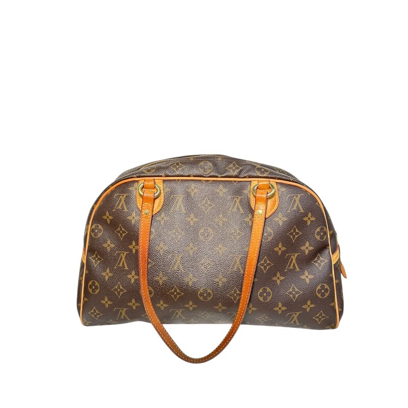 LOUIS VUITTON Monogram Montorgueil GM.<br />
<br />
 This chic bowling-style tote is crafted of traditional Louis Vuitton monogram-coated canvas. It features vachetta leather shoulder straps and trims, detailed with polished gold plated brass hardware. The wrap-around zipper opens to a cocoa brown fabric interior with a hanging patch pocket.<br />
Date Code: MI2038<br />
<br />
Dimensions:<br />
Length: 15 in<br />
Height: 9.5 in<br />
Width: 7 in<br />
Drop: 8.5 in<br />
<br />
Condition: Some darkening on handles.<br />
<br />
Does not include original dust bag or box.