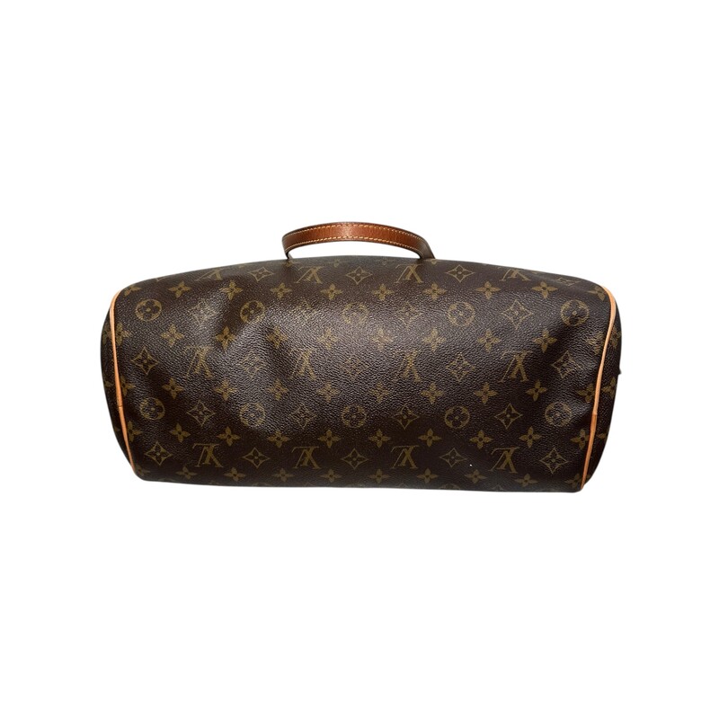 LOUIS VUITTON Monogram Montorgueil GM.<br />
<br />
 This chic bowling-style tote is crafted of traditional Louis Vuitton monogram-coated canvas. It features vachetta leather shoulder straps and trims, detailed with polished gold plated brass hardware. The wrap-around zipper opens to a cocoa brown fabric interior with a hanging patch pocket.<br />
Date Code: MI2038<br />
<br />
Dimensions:<br />
Length: 15 in<br />
Height: 9.5 in<br />
Width: 7 in<br />
Drop: 8.5 in<br />
<br />
Condition: Some darkening on handles.<br />
<br />
Does not include original dust bag or box.