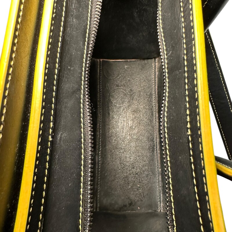 Celine Tote Yellow Trim Handbag<br />
 Black and Yellow<br />
Size: Nano<br />
<br />
Date Code:<br />
S-GA-41116<br />
<br />
Dimensions:<br />
Length: 8 in<br />
Height: 8.25 in<br />
Width: 3.75 in<br />
Drop: 2.25 in<br />
Drop: 20 in<br />
<br />
Yellow trim light cracking on top inside of handles. Light wear to inside pocket. Does not include original dust bag.