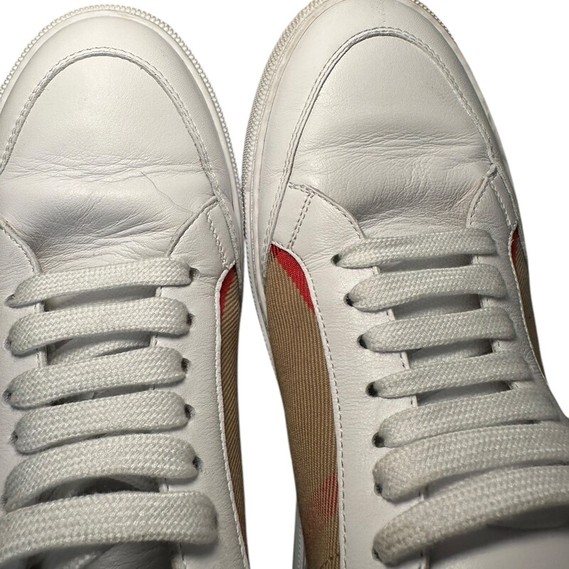 Burberry House Sneakers<br />
 White<br />
 Size: 38<br />
<br />
Light marks on the shoes and creasing.<br />
<br />
Does not come with original dust bag or box.