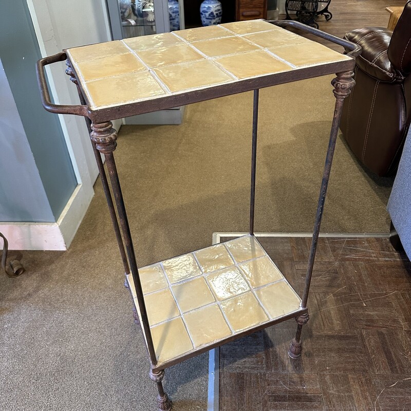 Double Tile Top Table,
 Size: 22.5x13x36
Lovely pale yellow tile on top and bottom encased in heavy metal frame.  This woud be a great table in the kitchen or on the sunporch.  It will not tip over easily!
Excellent condition