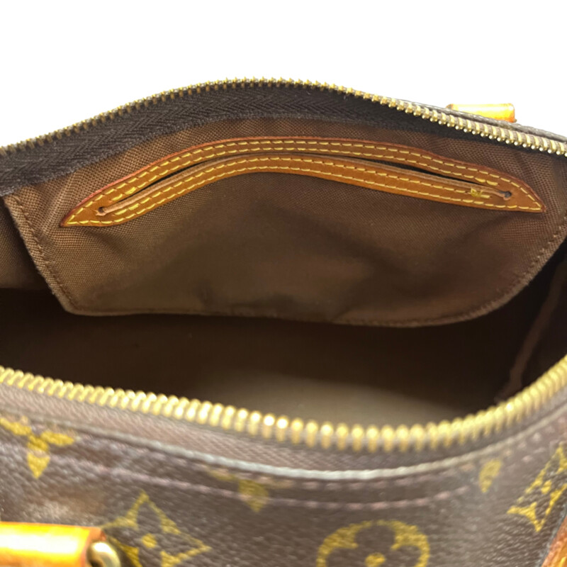 Louis Vuitton Speedy 30 Handbag<br />
Quality Made Leather with Monogram Print<br />
Top Handle Bag with Strap<br />
From the 1991 Collection<br />
Brown Coated Canvas<br />
Brass Hardware<br />
Rolled Handles<br />
Leather Trim Embellishment<br />
Canvas Lining & Single Interior Pocket<br />
Zip Closure at Top