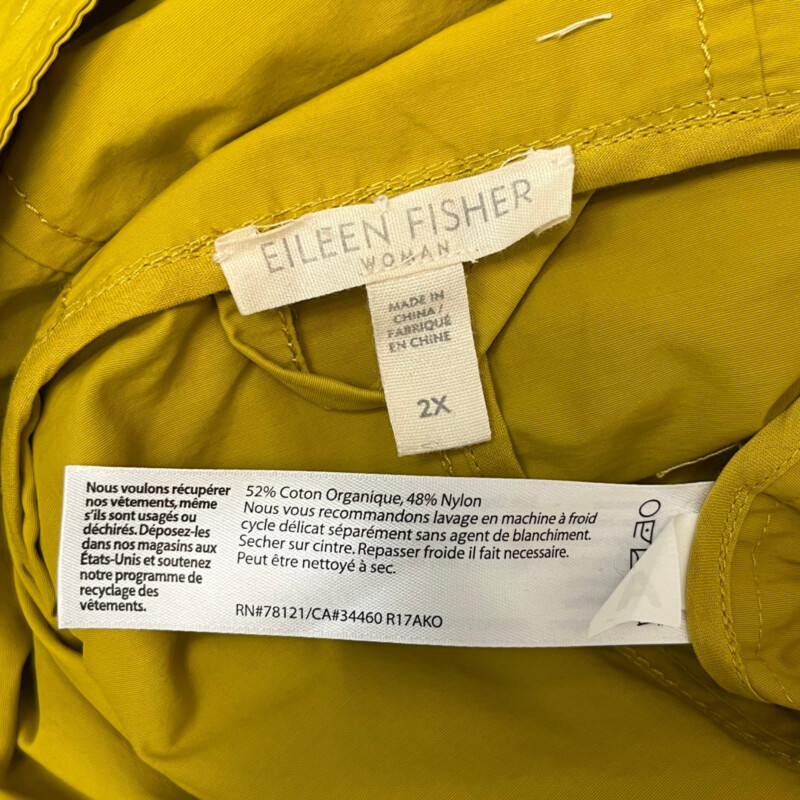 Eileen Fisher Raincoat<br />
Hooded with Zip and Button Closure<br />
Wider Sleeves for Easier Layering<br />
Pockets with Two Ways to Use<br />
Color: Mustard<br />
Size: 2X