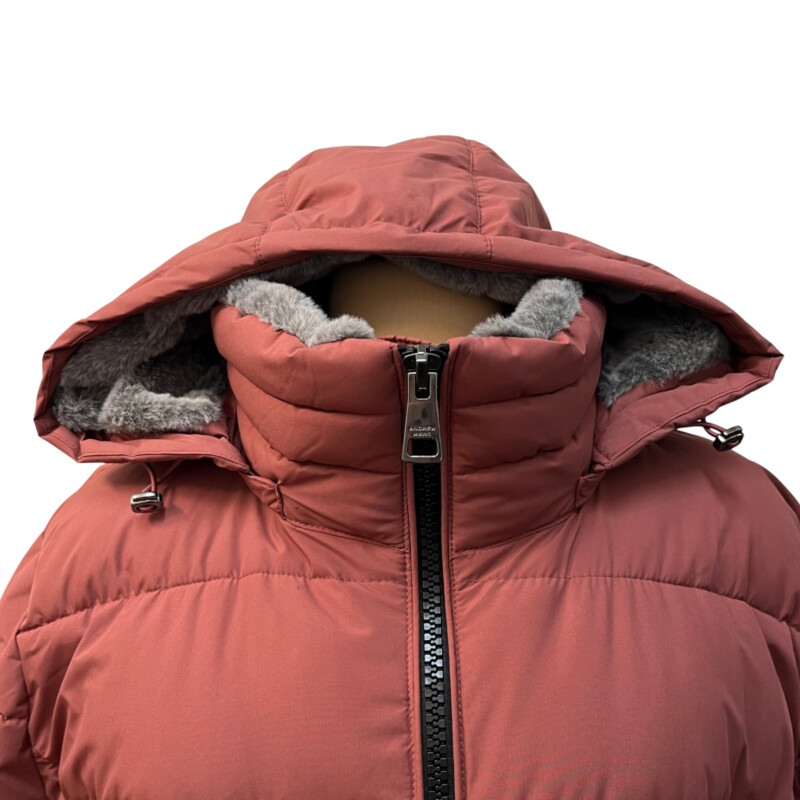 Andrew Marc Walker Coat Insulated Hooded Cold Weather Puffer Jacket<br />
Color: Terra Rose.<br />
Size: XXL = 16-18<br />
Color: Terra Rose.<br />
Fixed bib with zipper closure<br />
Stand collar with attached hood<br />
Snap front placket<br />
Cozy faux fur lined collar & hood<br />
Two front zipper pockets<br />
Branded logo trim at left sleeve<br />
Adjustable draw cord at hood<br />
Sorona® plant based 100% polyester fill<br />
Interior slit pocket<br />
Stretch side panel and undersleeve for mobility