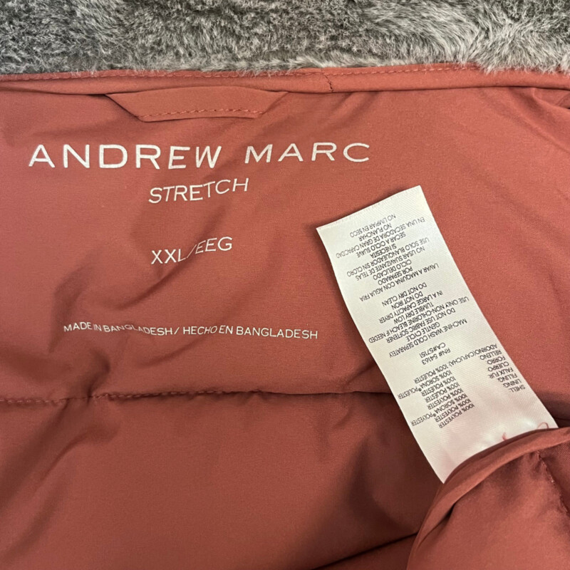 Andrew Marc Walker Coat Insulated Hooded Cold Weather Puffer Jacket<br />
Color: Terra Rose.<br />
Size: XXL = 16-18<br />
Color: Terra Rose.<br />
Fixed bib with zipper closure<br />
Stand collar with attached hood<br />
Snap front placket<br />
Cozy faux fur lined collar & hood<br />
Two front zipper pockets<br />
Branded logo trim at left sleeve<br />
Adjustable draw cord at hood<br />
Sorona® plant based 100% polyester fill<br />
Interior slit pocket<br />
Stretch side panel and undersleeve for mobility