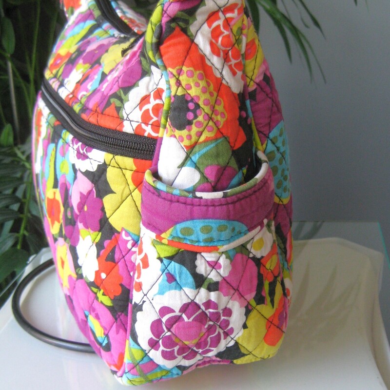 Vera Bradley Crossbody, Purple, Size: None<br />
Adjustable roomy crossbody bag from vera bradley in Va Va Bloom (2012) a vibrant dark floral<br />
large zip pocket and two side pockets outside<br />
One side of the interior is lined in a slick fabric and has two slip pockets,<br />
the other side is quilted cotton and it has a zippered pocket.<br />
11 x 8.25 x 4<br />
strap adjusts from 11 minimum to 23 maximum.<br />
excellent condition!<br />
thanks for looking!<br />
#79331