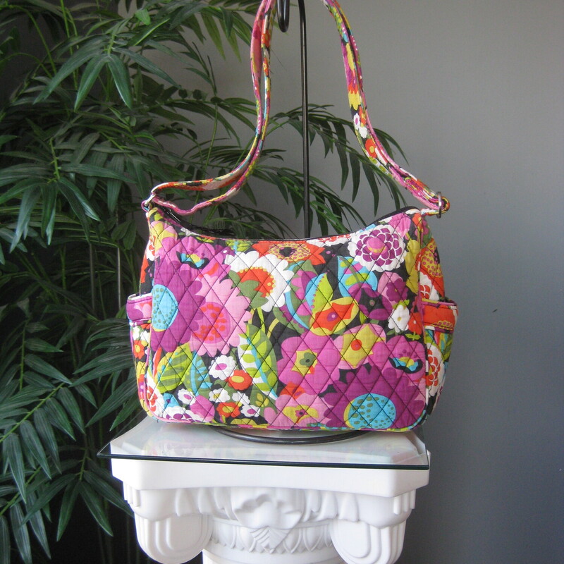 Vera Bradley Crossbody, Purple, Size: None<br />
Adjustable roomy crossbody bag from vera bradley in Va Va Bloom (2012) a vibrant dark floral<br />
large zip pocket and two side pockets outside<br />
One side of the interior is lined in a slick fabric and has two slip pockets,<br />
the other side is quilted cotton and it has a zippered pocket.<br />
11 x 8.25 x 4<br />
strap adjusts from 11 minimum to 23 maximum.<br />
excellent condition!<br />
thanks for looking!<br />
#79331