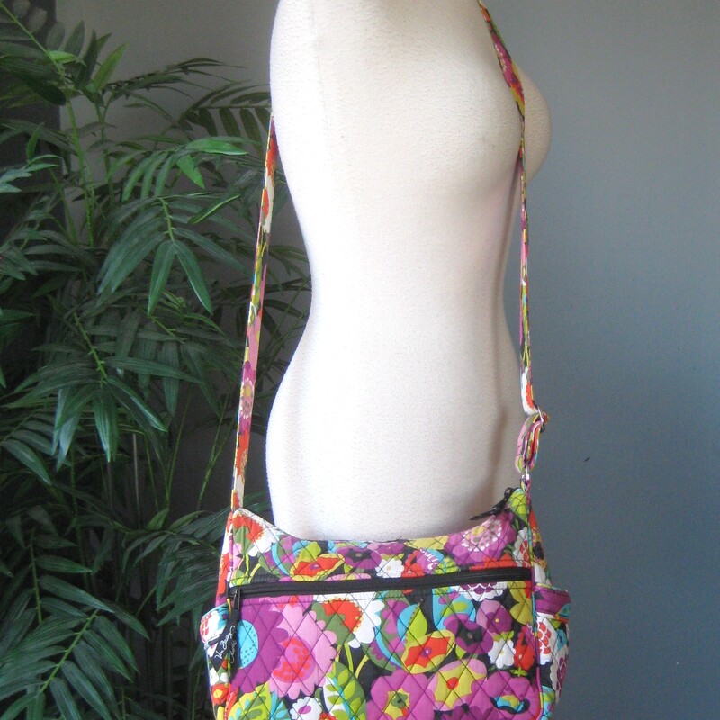 Vera Bradley Crossbody, Purple, Size: None<br />
Adjustable roomy crossbody bag from vera bradley in Va Va Bloom (2012) a vibrant dark floral<br />
large zip pocket and two side pockets outside<br />
One side of the interior is lined in a slick fabric and has two slip pockets,<br />
the other side is quilted cotton and it has a zippered pocket.<br />
11 x 8.25 x 4<br />
strap adjusts from 11 minimum to 23 maximum.<br />
excellent condition!<br />
thanks for looking!<br />
#79331