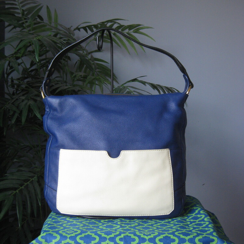 Very Roomy leather shoulder bag<br />
by Oryany<br />
This is their Adele bag<br />
Royal blue leather exterior with a large white slip pocket outside<br />
Black leather handle<br />
designer inspired cotton lining with two slip and 2 zippered pockets<br />
Top zip closure, brass bottom studs<br />
NWOT, original dust bag and crossbody strap  included<br />
13 x 13 x 4<br />
shoulder strap drop: 6<br />
crossbody strap is about 22 max and is adjustable.<br />
<br />
Thanks for looking!<br />
#80384