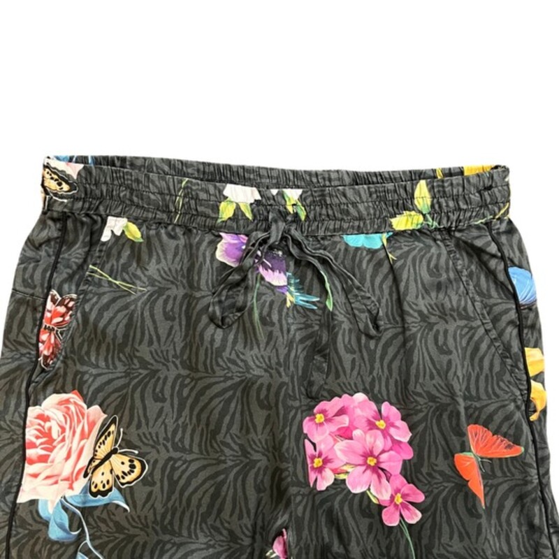 Johnny Was Blooming Elsie Jogger Pants<br />
<br />
The Blooming Elsie Jogger mixes style and comfort with its floral print and relaxed fit. The elegant stretch charmeuse fabric creates a draped look that works well with your favorite plain V-neck tee or with a simple silk tank top.<br />
Soft Silk Blend<br />
Elastic comfort waist<br />
Elastic pant leg hem<br />
Unique print featuring colorful flowers, butterflies, and hummingbirds on a gray zebra background<br />
Colors: Pink, Yellow, Blue, Green, Red, Orange, Purple, Light Gray, and Dark Gray<br />
Size: Small