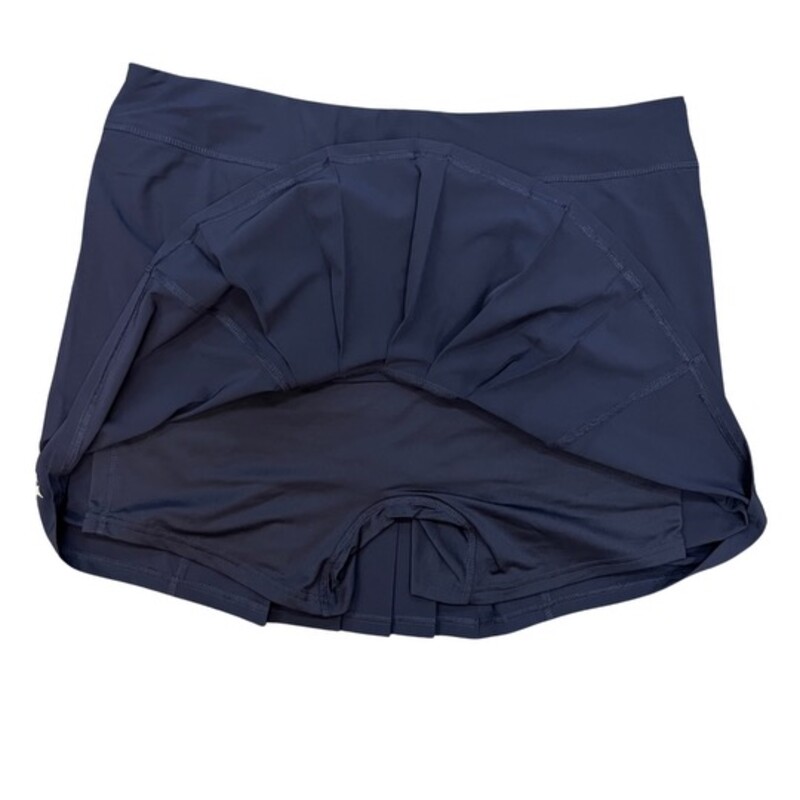 NEW Jofit Dash Skort<br />
Meet the Dash skort-a fun and flirty. The front and back pleats are a preppy twist. This style also boasts secure zipper front pockets and breathable undershorts.<br />
Pleat detail in front and back<br />
Secure front pockets with zippers<br />
Micromesh undershorts<br />
Pull on encased elastic waistband<br />
Color: Midnight Navy<br />
Size: XXL