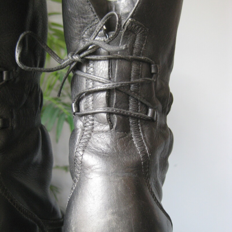 Edgy pair of Clark's Artisan boots in black<br />
size 8.5<br />
These are midcalf with an elastic gusset in the back and corset lacing over that so you can 'set it and forget it' with a perfect fit.<br />
Pretty floral lining<br />
2.75 heel.<br />
Good used condition.<br />
thanks for looking!<br />
#79341