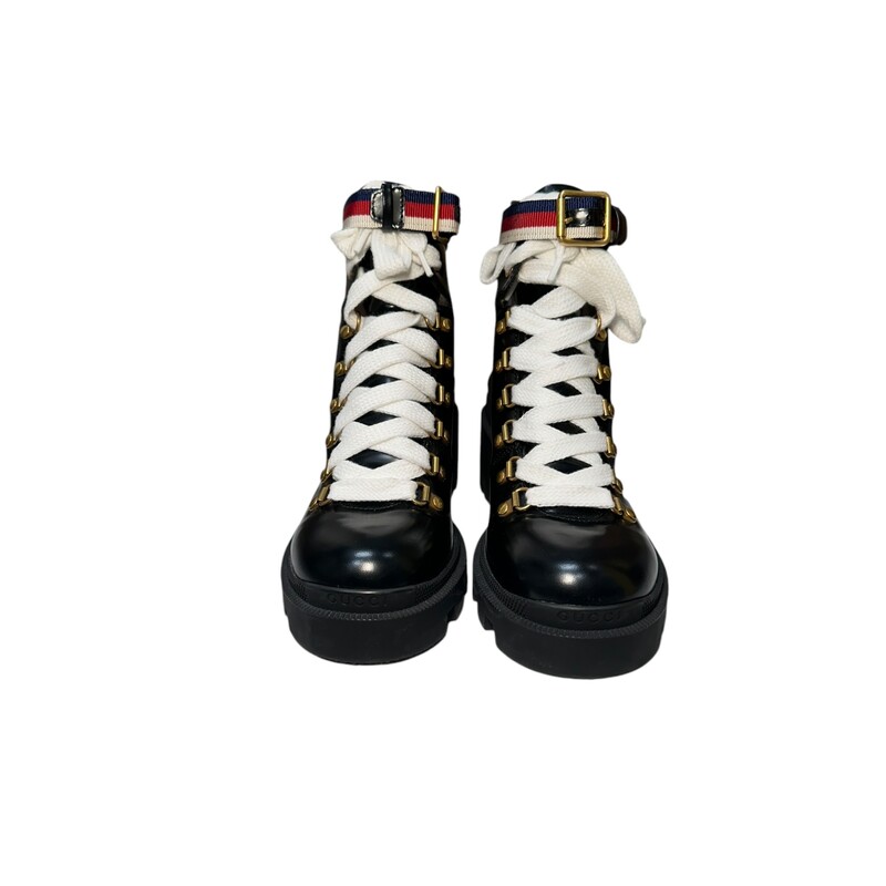 Gucci Magnum Combat Boots<br />
Size: 37<br />
Leather Ankle Combat Boots<br />
Sylvie Web Accent<br />
Rubber Trim<br />
Round-Toes<br />
Platform<br />
Wrap-Around Straps & Lace-Up Closure at Uppers<br />
Code:Code:481156-0411<br />
Does not come with orignal box or dust bag.