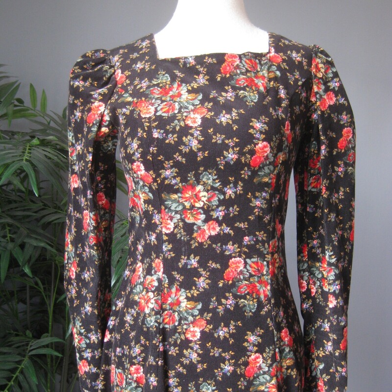 Vtg Laura Ashley Velvet, Blk/red, Size: 4<br />
This Laura Ashley dress is made of baby corduroy in a floral print.  The print has a black background which keeps it from being too 'sweet' and red and pink roses.  The long sleeves are puffy at the top.  The skirt is also very full and gathered into the defined waist line.<br />
The dress is 100% Cotton, nice and soft and unlined.<br />
Center back zipper<br />
Made in the UK<br />
<br />
It is marked size 4,  but it BARELY fits on my modern size for mannequin so please take the measurements I've provided below seriously, let me know if you have any questions about the f it I will get right back to you!<br />
<br />
 here are the flat measurements, please double where appropriate:<br />
Shoulder seam to shoulder seam: 14.5<br />
Armpit to Armpit: approx 17<br />
Waist: 14 1/2<br />
Hips: free up to 21.75<br />
length: 49<br />
Underarm sleeve seam: 16.5,<br />
sleeve from shoulder to cuff: 24<br />
Excellent condition! no flaws<br />
<br />
Thanks for looking.<br />
#80800