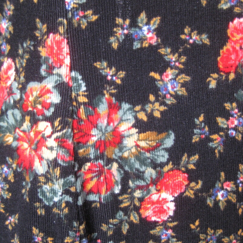 Vtg Laura Ashley Velvet, Blk/red, Size: 4<br />
This Laura Ashley dress is made of baby corduroy in a floral print.  The print has a black background which keeps it from being too 'sweet' and red and pink roses.  The long sleeves are puffy at the top.  The skirt is also very full and gathered into the defined waist line.<br />
The dress is 100% Cotton, nice and soft and unlined.<br />
Center back zipper<br />
Made in the UK<br />
<br />
It is marked size 4,  but it BARELY fits on my modern size for mannequin so please take the measurements I've provided below seriously, let me know if you have any questions about the f it I will get right back to you!<br />
<br />
 here are the flat measurements, please double where appropriate:<br />
Shoulder seam to shoulder seam: 14.5<br />
Armpit to Armpit: approx 17<br />
Waist: 14 1/2<br />
Hips: free up to 21.75<br />
length: 49<br />
Underarm sleeve seam: 16.5,<br />
sleeve from shoulder to cuff: 24<br />
Excellent condition! no flaws<br />
<br />
Thanks for looking.<br />
#80800