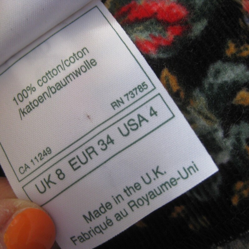 Vtg Laura Ashley Velvet, Blk/red, Size: 4<br />
This Laura Ashley dress is made of baby corduroy in a floral print.  The print has a black background which keeps it from being too 'sweet' and red and pink roses.  The long sleeves are puffy at the top.  The skirt is also very full and gathered into the defined waist line.<br />
The dress is 100% Cotton, nice and soft and unlined.<br />
Center back zipper<br />
Made in the UK<br />
<br />
It is marked size 4,  but it BARELY fits on my modern size for mannequin so please take the measurements I've provided below seriously, let me know if you have any questions about the f it I will get right back to you!<br />
<br />
 here are the flat measurements, please double where appropriate:<br />
Shoulder seam to shoulder seam: 14.5<br />
Armpit to Armpit: approx 17<br />
Waist: 14 1/2<br />
Hips: free up to 21.75<br />
length: 49<br />
Underarm sleeve seam: 16.5,<br />
sleeve from shoulder to cuff: 24<br />
Excellent condition! no flaws<br />
<br />
Thanks for looking.<br />
#80800