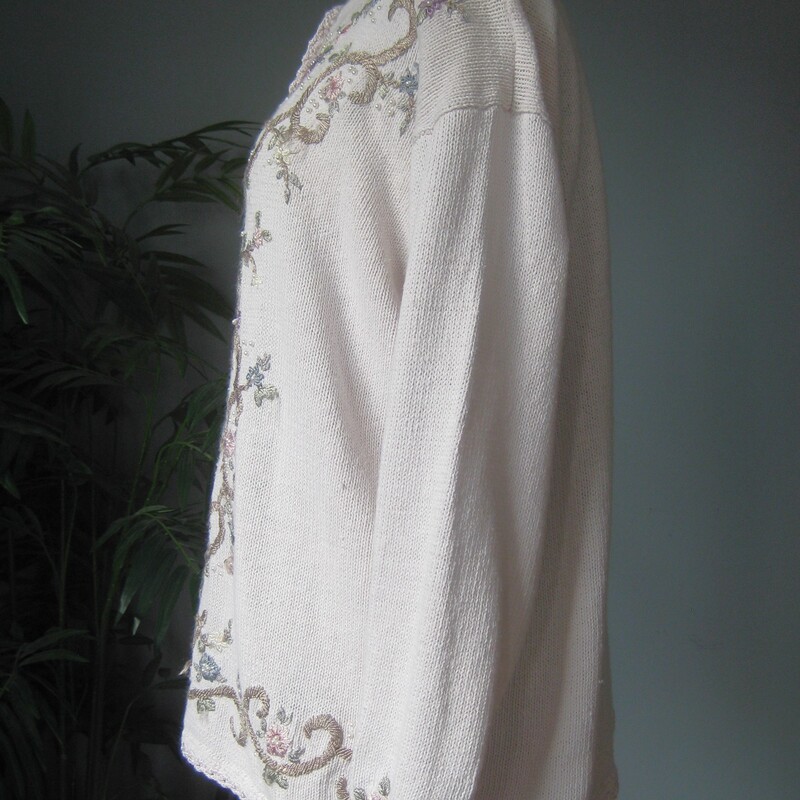 Vtg Jenny Embrd, Baby Pin, Size: Medium<br />
This sweater by Jenny is from the 1980s or maybe early 90s<br />
Very pretty embroidered all over with flowers, scrolling vines and pearls.<br />
Tunic length with decorated long sleeves<br />
Cotton Ramie blend<br />
Four pearl buttons at the neck that do open.<br />
the background appears white but it's actually the palest of pale pinks.<br />
Here are the flat measurements, please double where appropriate:<br />
Shoulder to shoulder: 22 these are 'dropped shoulders' the shoulder seam will hand down your arm a couple of inches.<br />
Armpit to armpit: 22.5<br />
Width at hem: 22<br />
Underarm sleeve seam length: 17<br />
Length from neck to hem: 26<br />
Excellent condition, minor imperfection or two on the embroidery floss near the waist area, pls see all of my photos.<br />
Thanks for looking!<br />
#79452