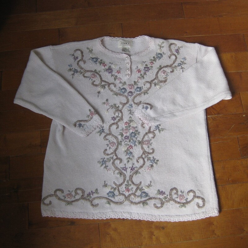 Vtg Jenny Embrd, Baby Pin, Size: Medium<br />
This sweater by Jenny is from the 1980s or maybe early 90s<br />
Very pretty embroidered all over with flowers, scrolling vines and pearls.<br />
Tunic length with decorated long sleeves<br />
Cotton Ramie blend<br />
Four pearl buttons at the neck that do open.<br />
the background appears white but it's actually the palest of pale pinks.<br />
Here are the flat measurements, please double where appropriate:<br />
Shoulder to shoulder: 22 these are 'dropped shoulders' the shoulder seam will hand down your arm a couple of inches.<br />
Armpit to armpit: 22.5<br />
Width at hem: 22<br />
Underarm sleeve seam length: 17<br />
Length from neck to hem: 26<br />
Excellent condition, minor imperfection or two on the embroidery floss near the waist area, pls see all of my photos.<br />
Thanks for looking!<br />
#79452