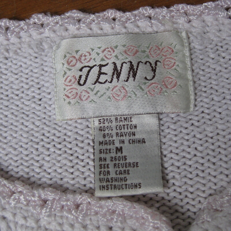 Vtg Jenny Embrd, Baby Pin, Size: Medium<br />
This sweater by Jenny is from the 1980s or maybe early 90s<br />
Very pretty embroidered all over with flowers, scrolling vines and pearls.<br />
Tunic length with decorated long sleeves<br />
Cotton Ramie blend<br />
Four pearl buttons at the neck that do open.<br />
the background appears white but it's actually the palest of pale pinks.<br />
Here are the flat measurements, please double where appropriate:<br />
Shoulder to shoulder: 22 these are 'dropped shoulders' the shoulder seam will hand down your arm a couple of inches.<br />
Armpit to armpit: 22.5<br />
Width at hem: 22<br />
Underarm sleeve seam length: 17<br />
Length from neck to hem: 26<br />
Excellent condition, minor imperfection or two on the embroidery floss near the waist area, pls see all of my photos.<br />
Thanks for looking!<br />
#79452