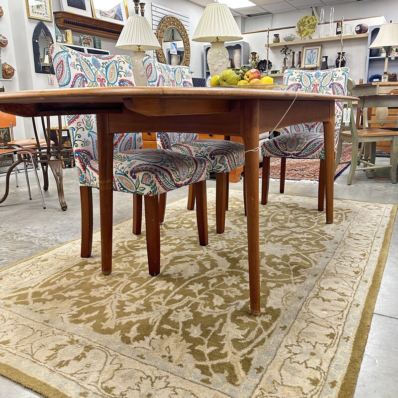 Beautiful Mid Century Modern Elsteds Dining Table, made in Denmark Table circa 1960s.
Size: 63L x 36W, PLUS one self-storing 30in leaf. Table only; no chairs are included.