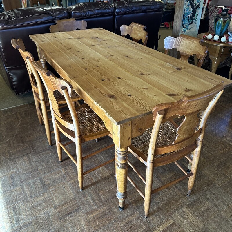 Harvest Table/6 Chairs,
Size: 68x31x31
Beautiful English Pine Harvest table.  Hard pine in beautiful condition.  6 Tiger Maple chairs with cane seats make this a beautiful set!