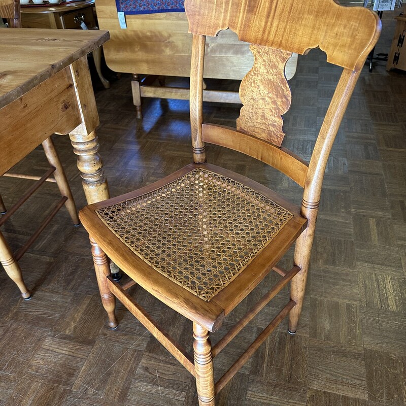 Harvest Table/6 Chairs,
Size: 68x31x31
Beautiful English Pine Harvest table.  Hard pine in beautiful condition.  6 Tiger Maple chairs with cane seats make this a beautiful set!