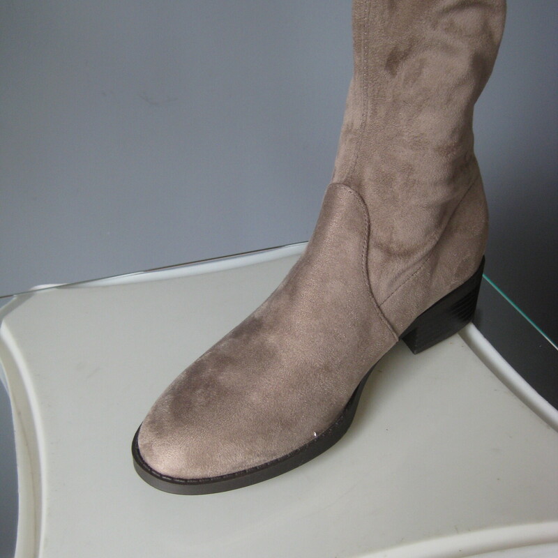 Cool and comfortable over the knee boots from Unisa<br />
Taupe faux suede fabric.<br />
flat<br />
there's a tie in the back to secure them at the top.<br />
size 7.5<br />
<br />
Pls note, These are brand new with original packing materials.  I WILL NOT be shipping them in the box to keep shipping cost low.<br />
<br />
thanks for looking!<br />
#80938