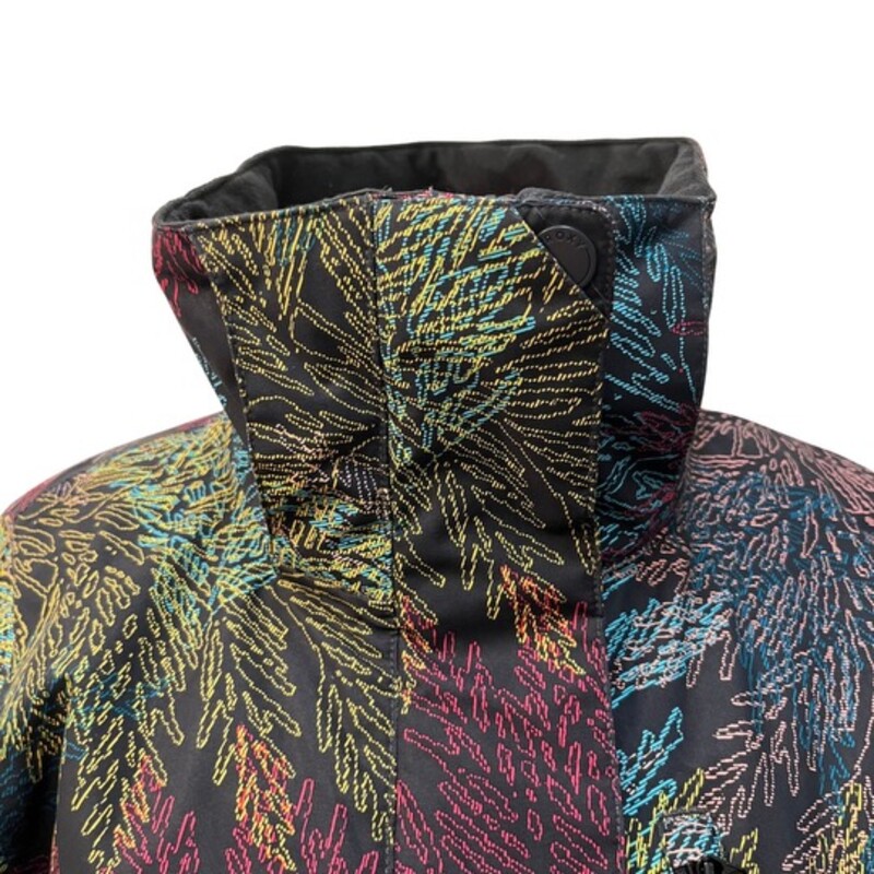 Roxy Dry Flight Snow Jacket<br />
Color: Black with Multi Colored Leaf Print<br />
Size: XS<br />
Features:<br />
- 10K ROXY DryFlight® technology for better waterproofing [10,000 mm/5000g]<br />
- Polyester plain weave fabric<br />
- ROXY WarmFlight® Eco insulation [Fill weight: 120g body, 100g sleeves, 60g hood]<br />
- Lightweight polyester taffeta lining with brushed tricot<br />
- Seam taping at critical zones<br />
- 3-way adjustable fixed hood<br />
- Fixed taffeta powder skirt<br />
- Tuck away powder skirt system with snap fastener<br />
- Jacket-to-pant attachment system<br />
- Chest pocket<br />
- Hand-warmer pockets<br />
- Sleeve pass pocket<br />
- Internal media and goggle pockets<br />
- Mesh lined underarm vents<br />
- Internal stretch wrist gaiters<br />
- Cuffs with gusset<br />
- Chin guard<br />
- Key clip