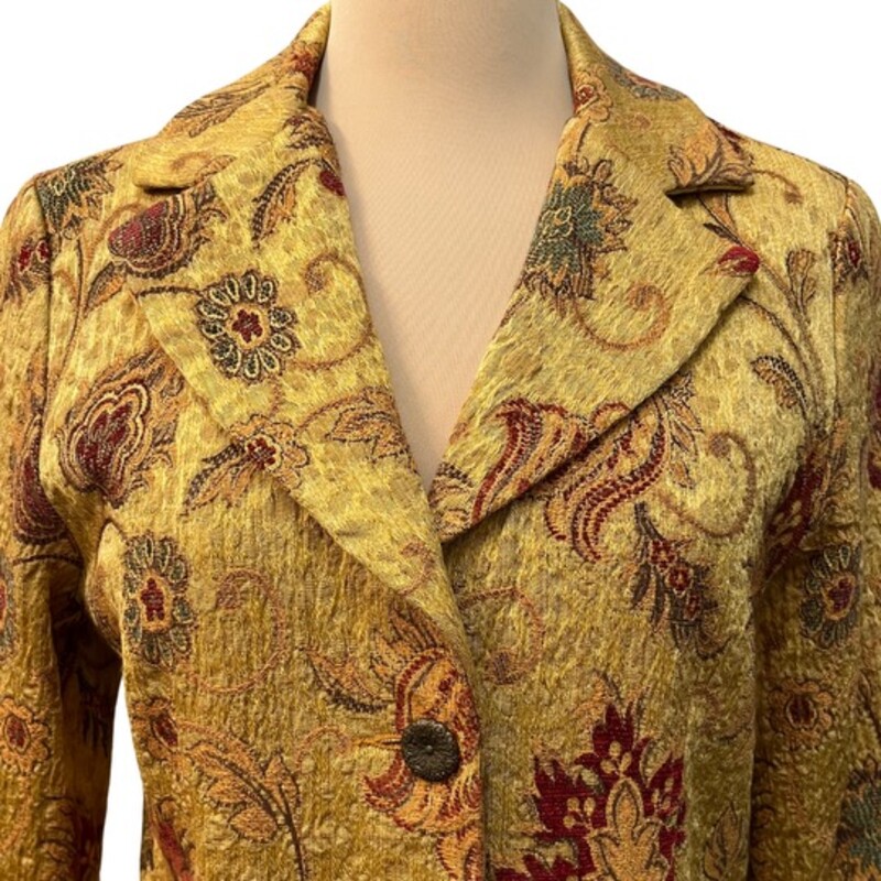 CAbi Guinevere Tapestry Car Coat<br />
This stunning piece features a gorgeous tapestry print, classic collar, and three bronze buttons up the front.<br />
Colors: Gold, Burgundy, Brown, and Green<br />
Size: Small