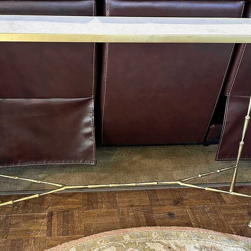 Gold Console Tbl W/Marble,
 Size: 44x10x32
This console table has delicately designed legs with a cream colored marble insert.  It is very sturdy and in excellent condition. Perfect for the holidays