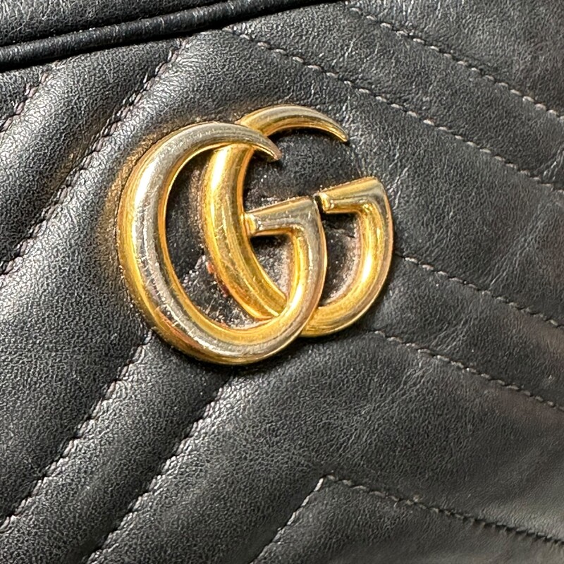 Gucci Marmont Black Mini Shoulder Bag<br />
<br />
Style Code:448065 493075<br />
<br />
Dimensions: 6.5L x 4 H<br />
<br />
Comes with original dust bag but no box<br />
<br />
Some Wear: Hardware discolored and interior stains.