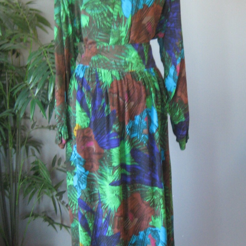 Two piece set is done in green, blue and brown tropical print silk<br />
to mix match or use just for the large amount of gorgeous silk<br />
You get :<br />
Long sleeve button down shirt with one chest pocket marked size 8, but will fit a modern size large<br />
A high waisted button down very full gathered skirt with a wide yoke.  It buttons all the way open down the side.<br />
Both pieces are unline<br />
Measurements provided are taken flat across the garments<br />
Skirt: marked size 14<br />
waist: 17.5<br />
hips: free<br />
length: 35<br />
Shirt:<br />
Medium Shoulder pads, semi sheer, marked size 8<br />
armpit to armpit: 22.5<br />
length: 28<br />
underarm sleeve seam: 21<br />
Thanks for looking!<br />
#72258